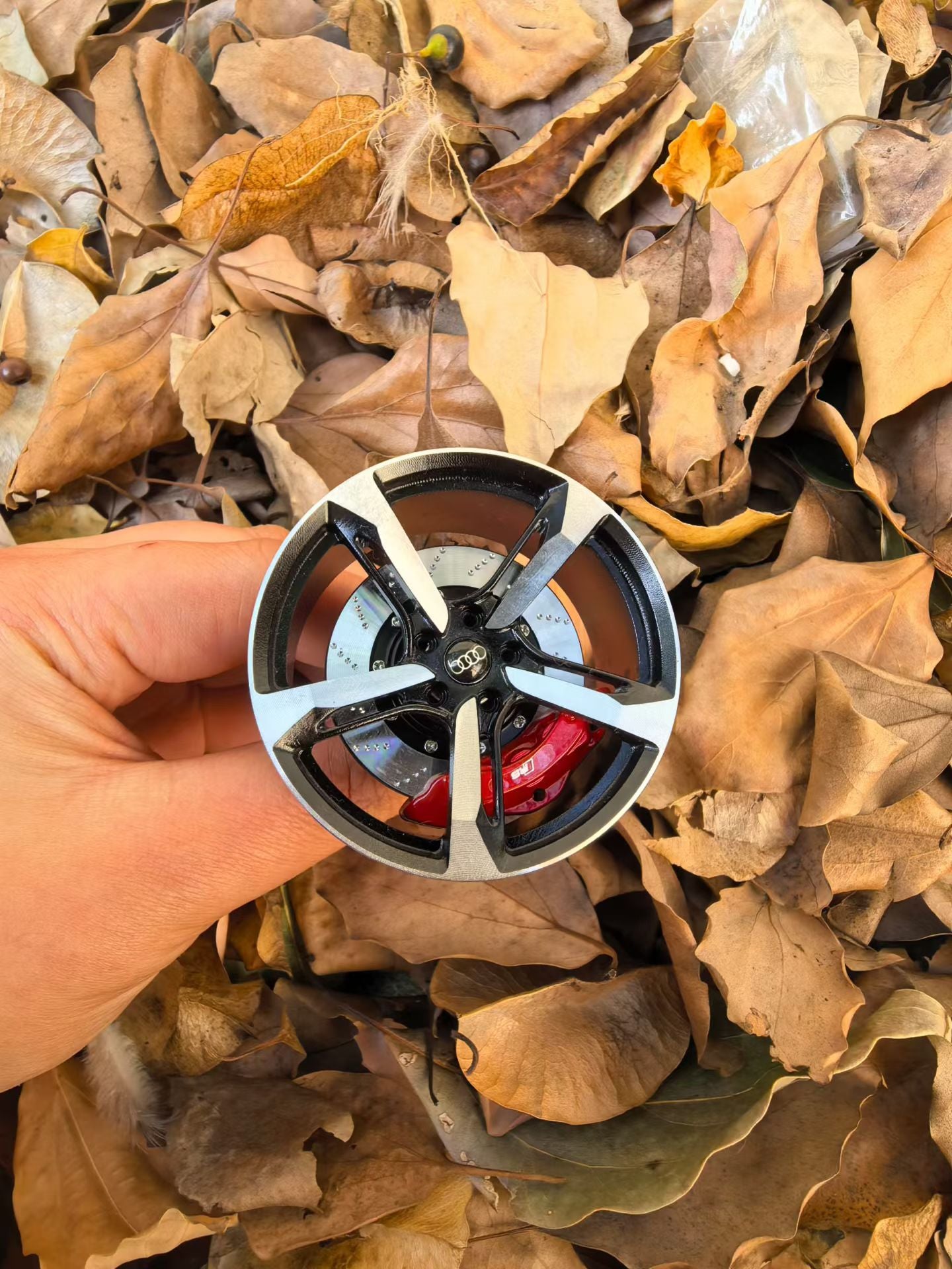 Miniature Audi RS wheel-shaped air freshener by WheelWorkCustoms, detailed design, compact and decorative car accessory.