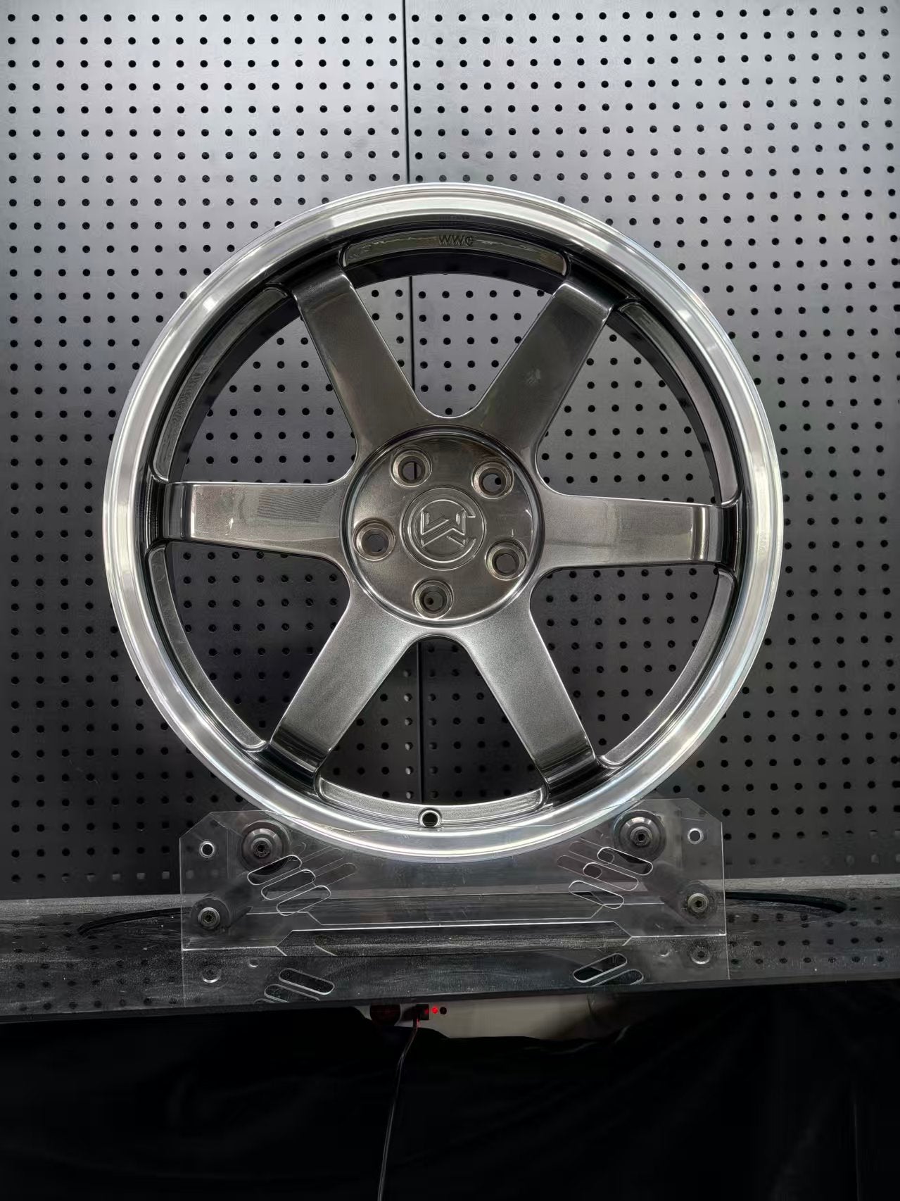 Custom forged WWC 6 spoke Motorsport wheels by WheelWorkCustoms, showcasing sleek black finish and detailed wheel design.