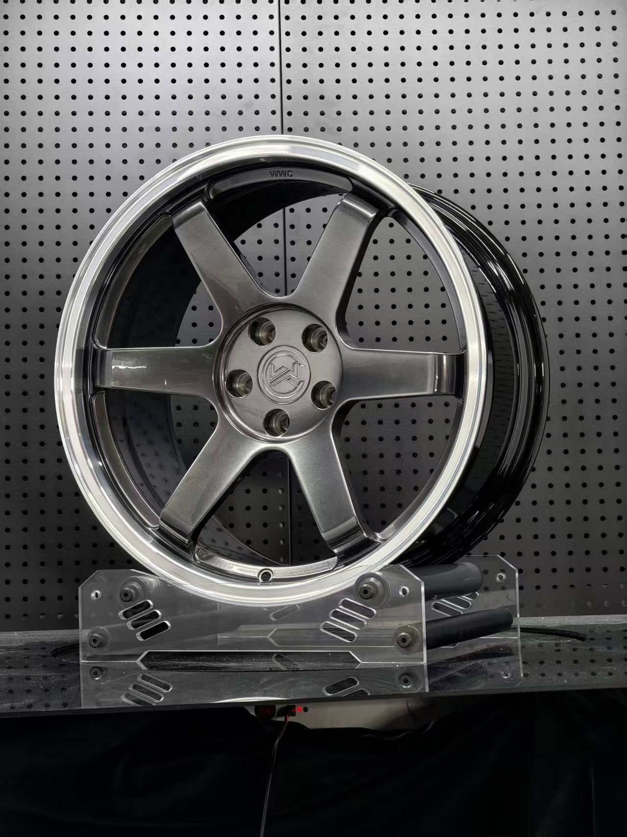 Custom forged WWC 6-spoke Motorsport wheels by WheelWorkCustoms, featuring a sleek, high-performance design for racing cars.