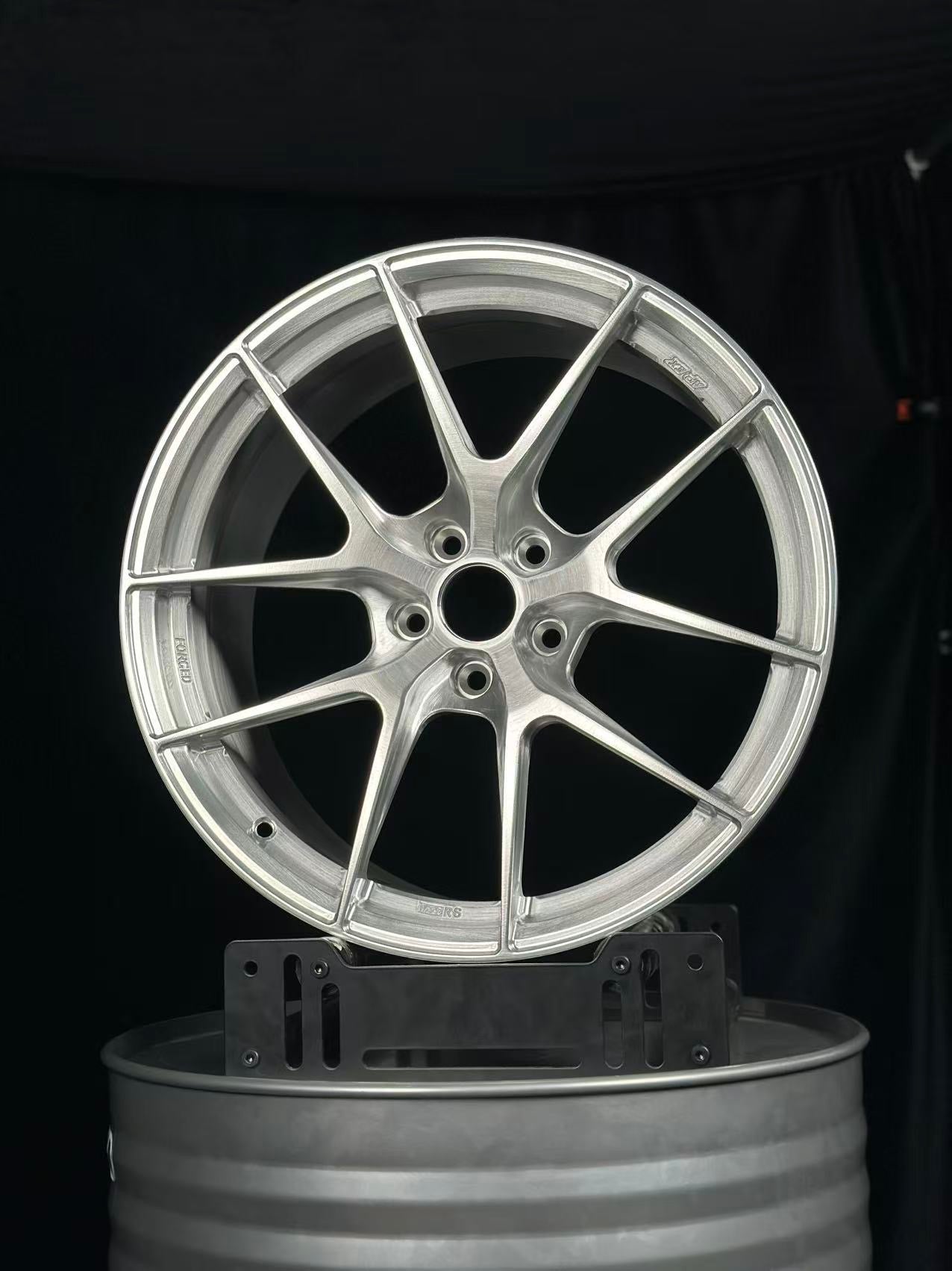 Custom forged WheelWorkCustoms WWC VS5R 5-spoke performance wheel showing sleek black finish and detailed spoke design.