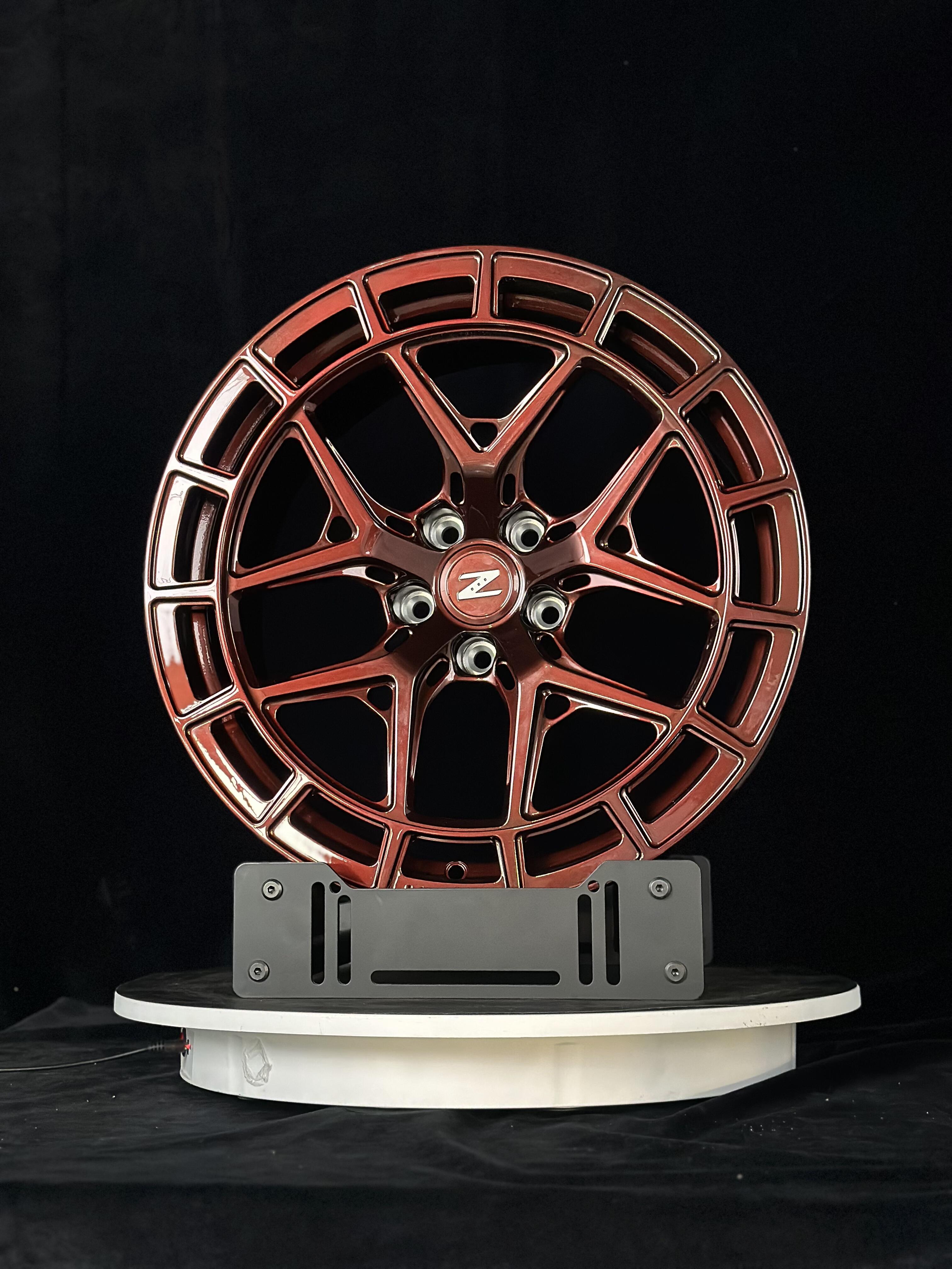 Custom forged WheelWorkCustoms WWC HFX1 Performance wheels with sleek black finish and intricate spoke design.