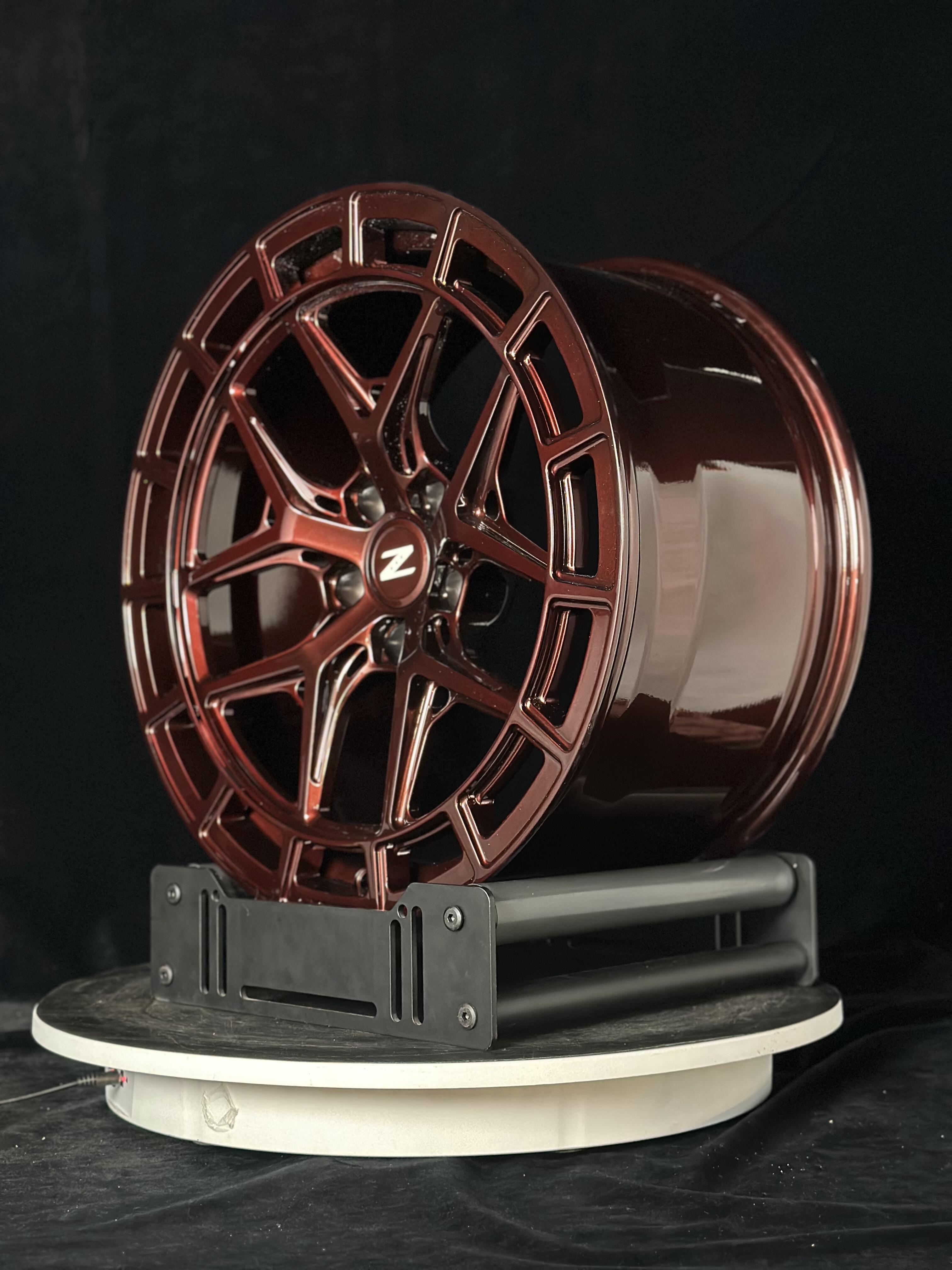 Custom forged WheelWorkCustoms WWC HFX1 Performance wheels with sleek black finish and multi-spoke design on a car.